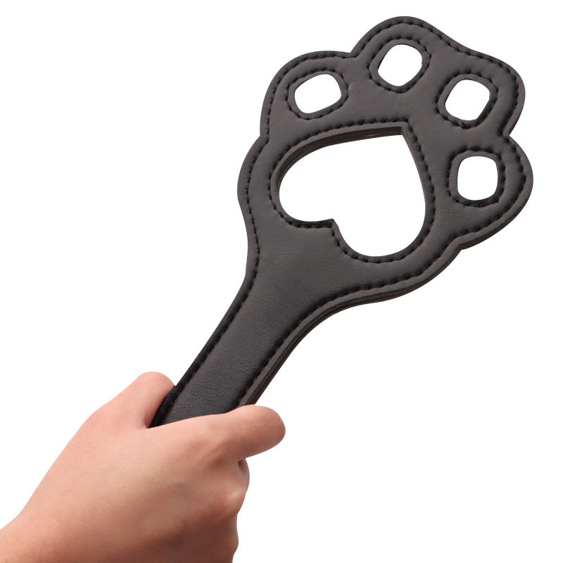 Hand Holding Leather Paw Paddle