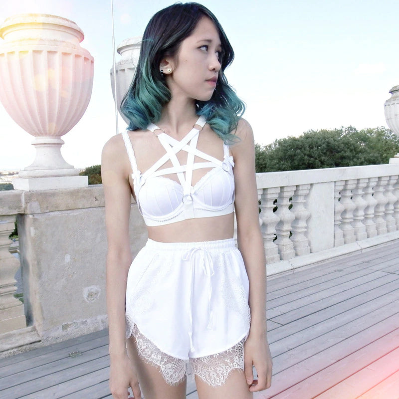 Woman Wearing White Pentagram Ring Harness