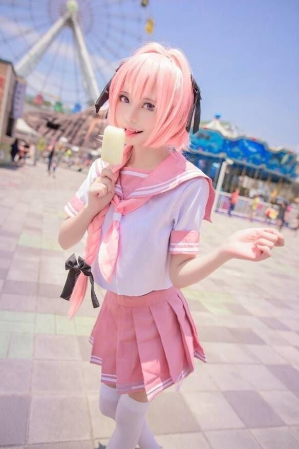 Women Wearing Pink Sailor Schoolgirl eating icecream