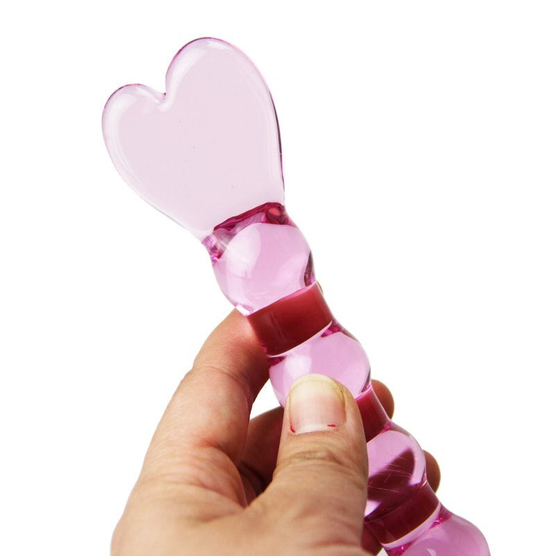 Hand Holding Pink Heart Beaded Glass Dildo Close Up